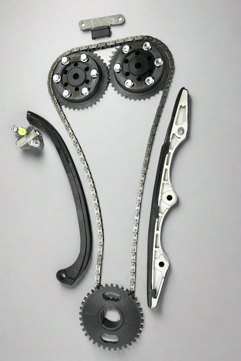 Load image into Gallery viewer, Automotive timing chain set with gears and sprockets on a white background