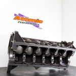 Engine block on a stand with 'Atomic Performance' logo in the background