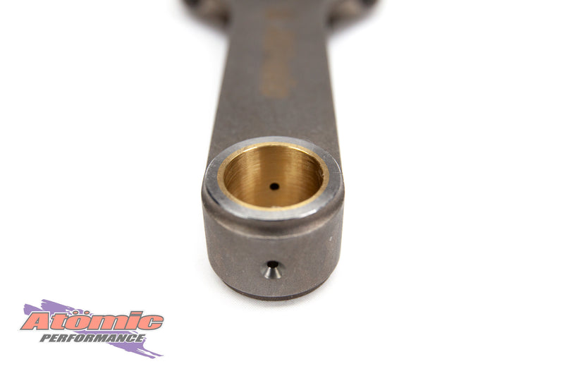Load image into Gallery viewer, Metal connecting rod with brass bushing on a white background, featuring Atomic Performance logo.
