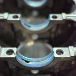 close-up of main bearing installation inside engine block