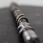 Close-up of a camshaft on a dark background