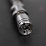 Close-up of a camshaft dowel on a dark background