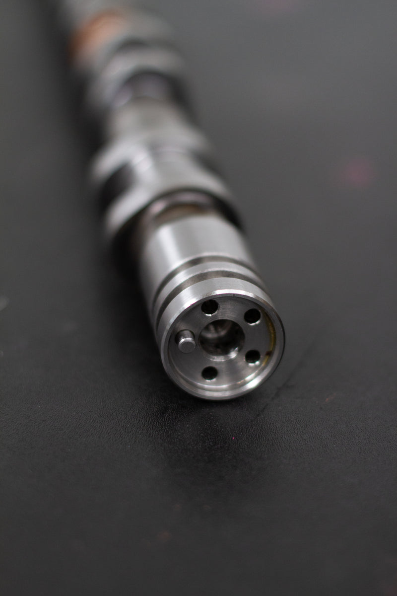 Load image into Gallery viewer, Close-up of a camshaft dowel on a dark background
