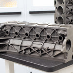 engine cast block on a black bench 