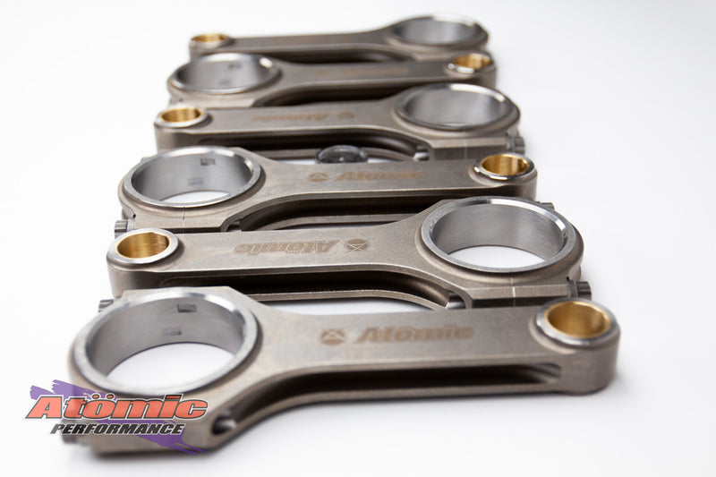 Load image into Gallery viewer, Set of metallic connecting rods with &#39;Atomic&#39; branding on a white background
