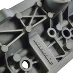 close up of atomic logo within cast engine block with white background