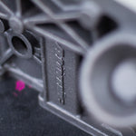 close-up of logo on cast engine block on a black surface