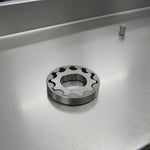 steel oil pump gears on a steel background