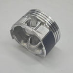 Metallic piston on a light gray background