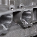close up of a engine cylinder head intake ports